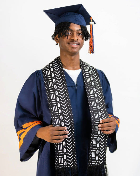 Student wearing graduation cap and gown wearing Black & White Print Sash